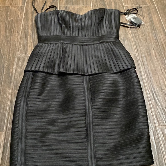 BCBGMaxAzria Dresses & Skirts - BCBGMaxAzria black strapless sweetheart peplum dress